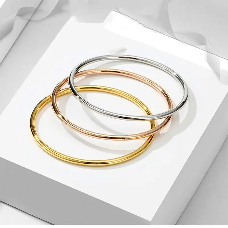 

Hot selling Contracted Gold Titanium Steel Coil Bracelet 2mm Women Round Fine Wire Coil Thin Bracelet, Accept customer