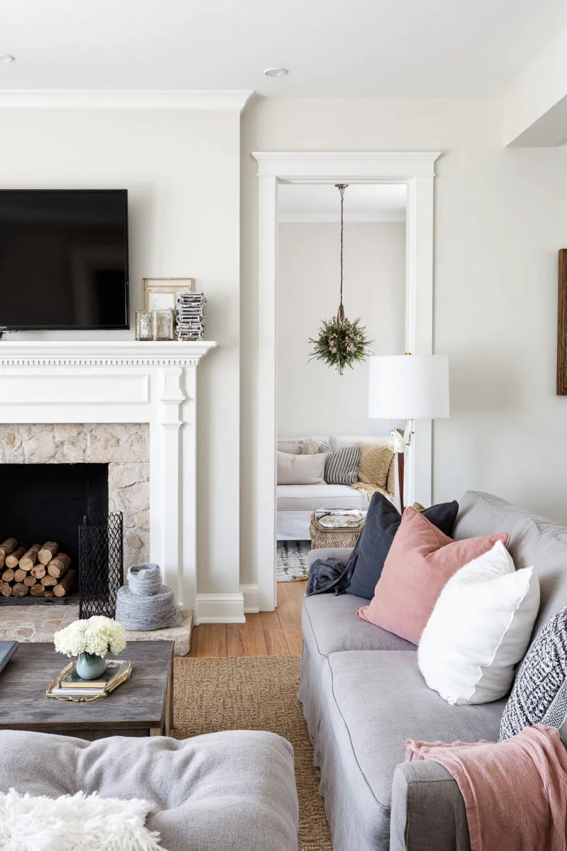 White mantle fireplace decorated across all four seasons