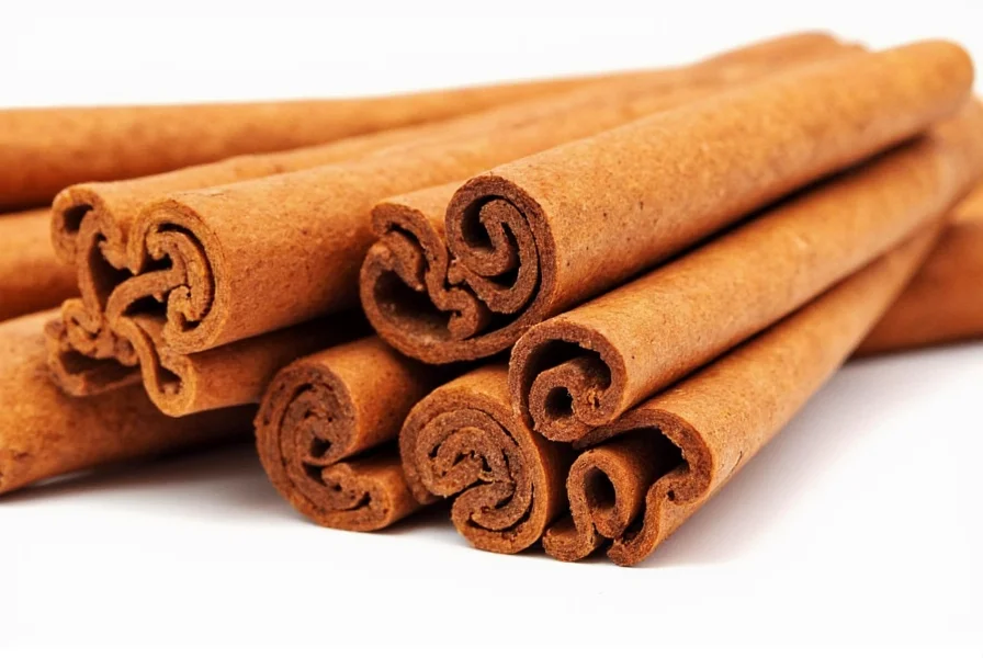 Close-up of cinnamon sticks and powder next to fresh fruit showing natural cinnamon benefits for women