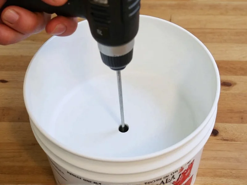 Drilling holes in bucket for chicken feeder