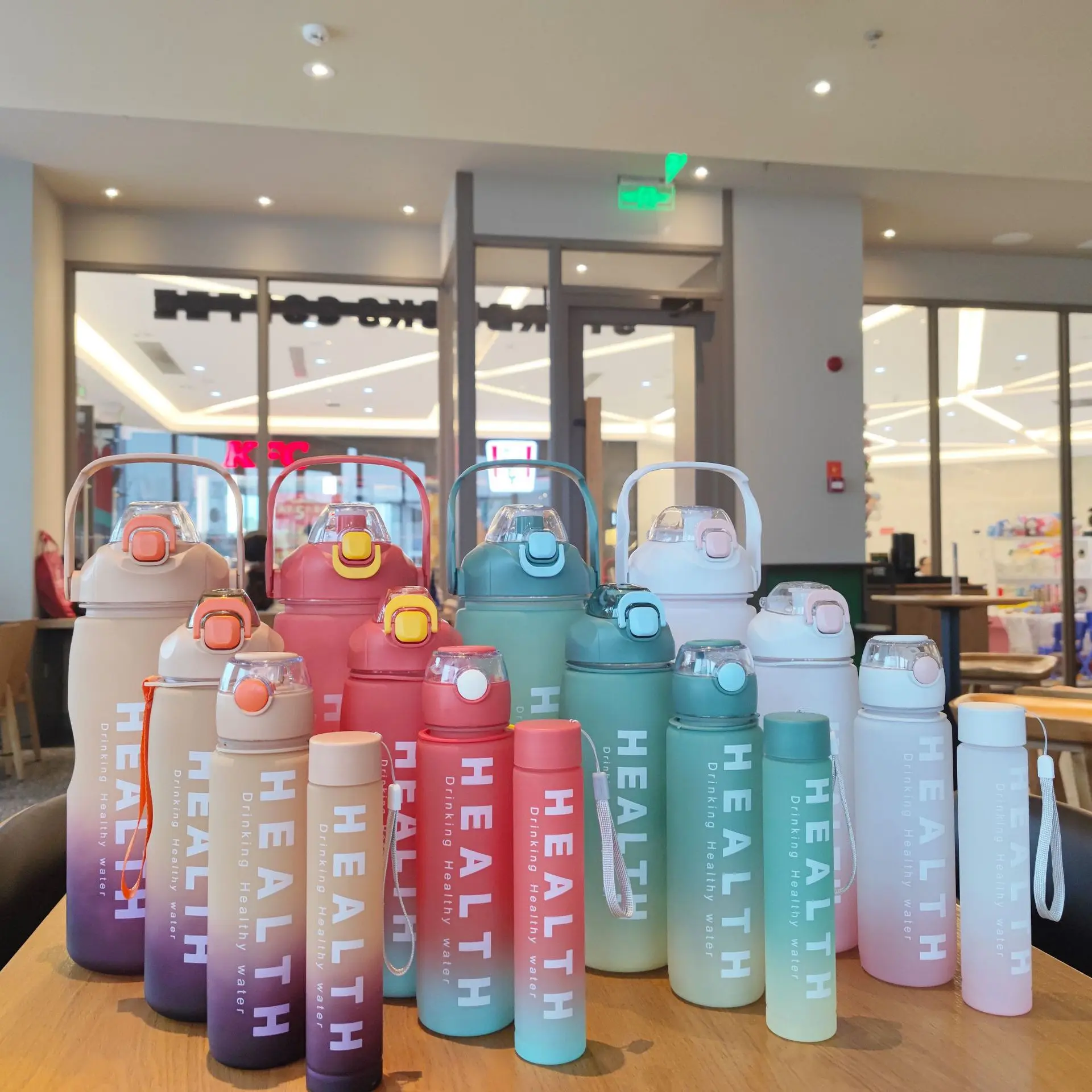 

BPA Free 4 Pcs In 1 Set Large Capacity Motivational Plastic Water Bottle Gradient Color With Straw And Lid