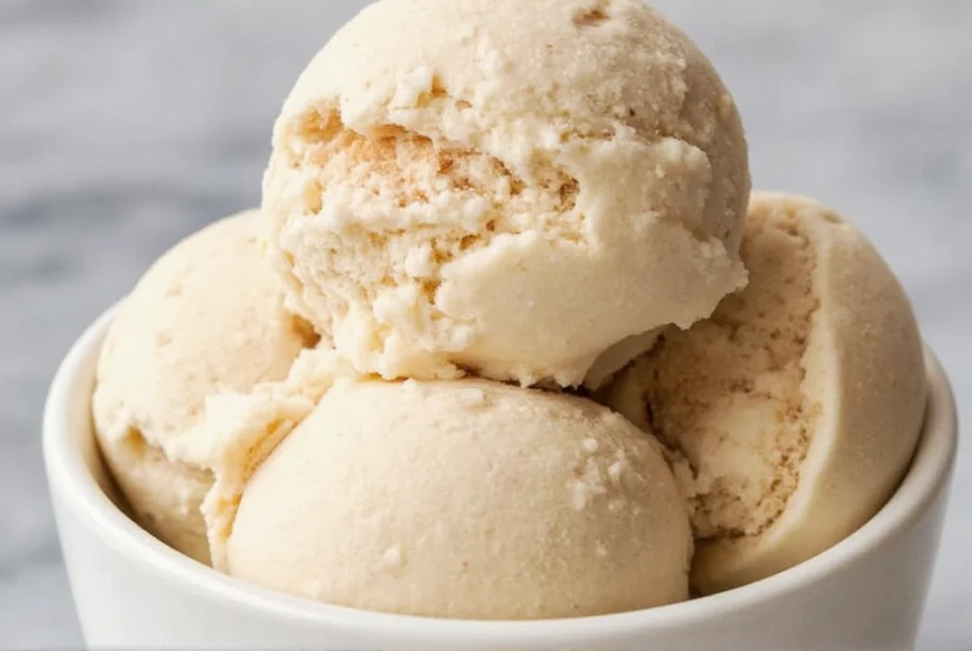 Homemade cinnamon ice cream in a vintage glass bowl with cinnamon sticks and fresh whipped cream