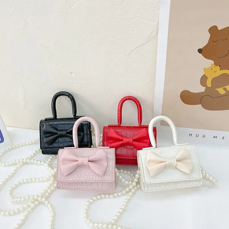 

Girls messenger bag 2022 new cute bow pearl children's handbag fashion stone pattern baby backpack