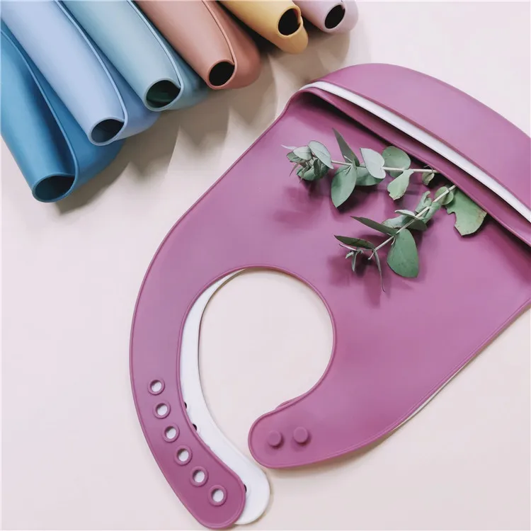 

2021 Kid Wholesale New Bpa Free and Eco friendly Soft Custom Food Grade Silicone Baby bib with food catcher, Customized color