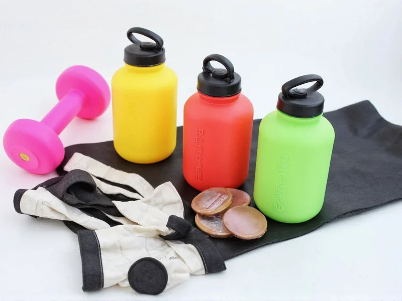 Water bottle dumbbells and resistance band setup for home gym