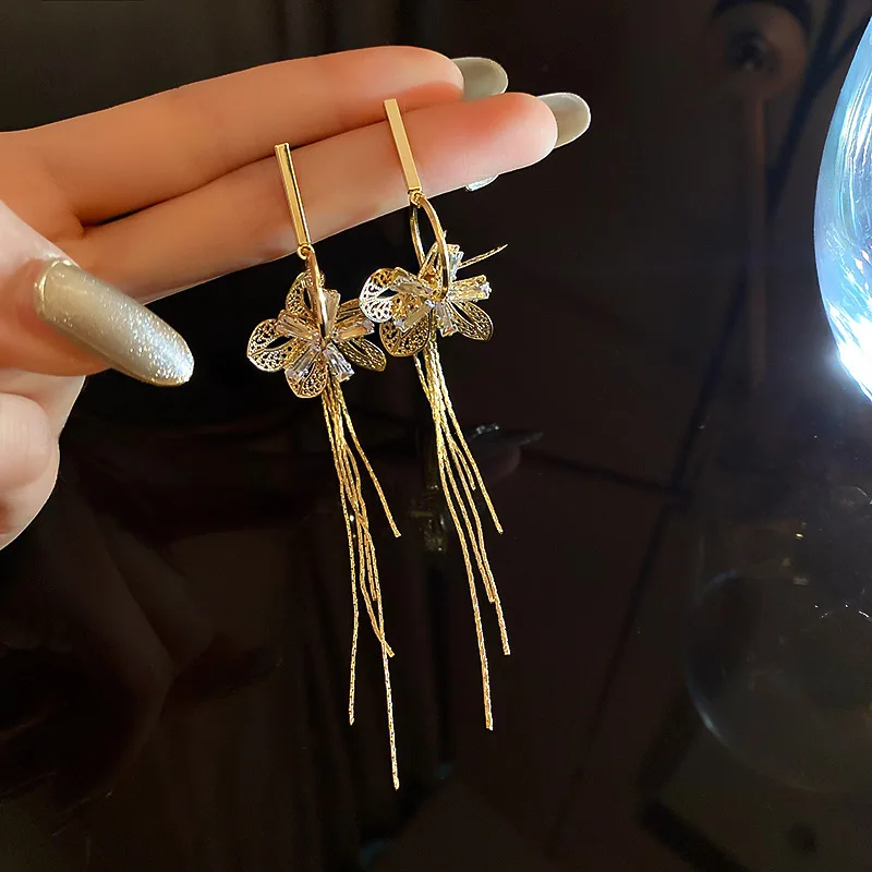 

trendy fashion crystal flower dangling long gold plated earrings