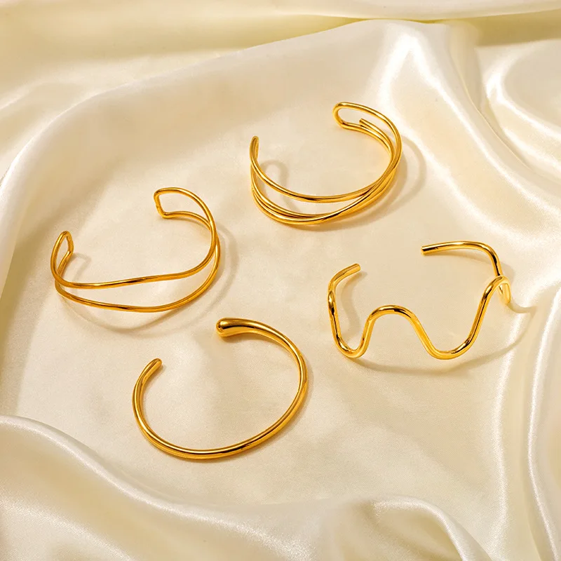 YF6074 New Minimalist Stainless Steel 18k Gold Plated Wavy Line Cross Winding Open Bracelet Waterproof
