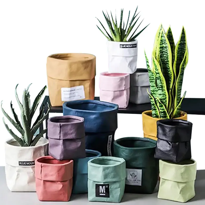 

Redeco 2022 New Trend Morden Luxury Decorative Flower Pots Simulation Kraft Paper Bag Design With Drainage Ceramic Planter, Customized color