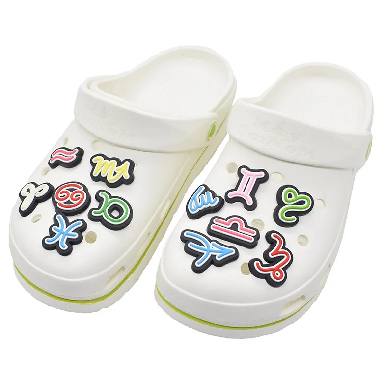 

Wholesale inventory design fashion cartoon twelve constellation pvc clogs flower shoes charm, As picture/custom
