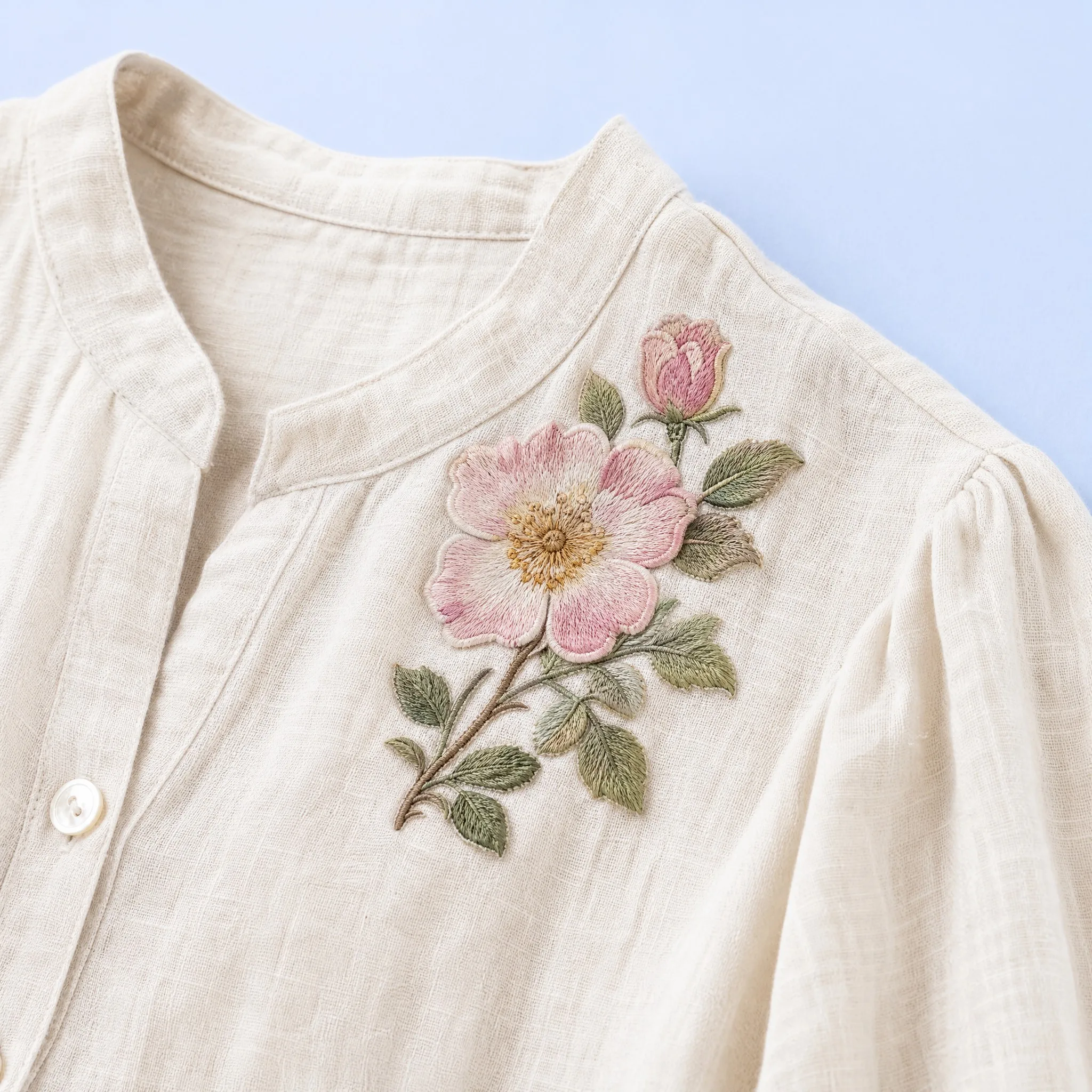 Delicate Pink Wild Rose Floral Patch Stitched onto Upper Chest of Natural Off-White Linen Mandarin Collar Blouse