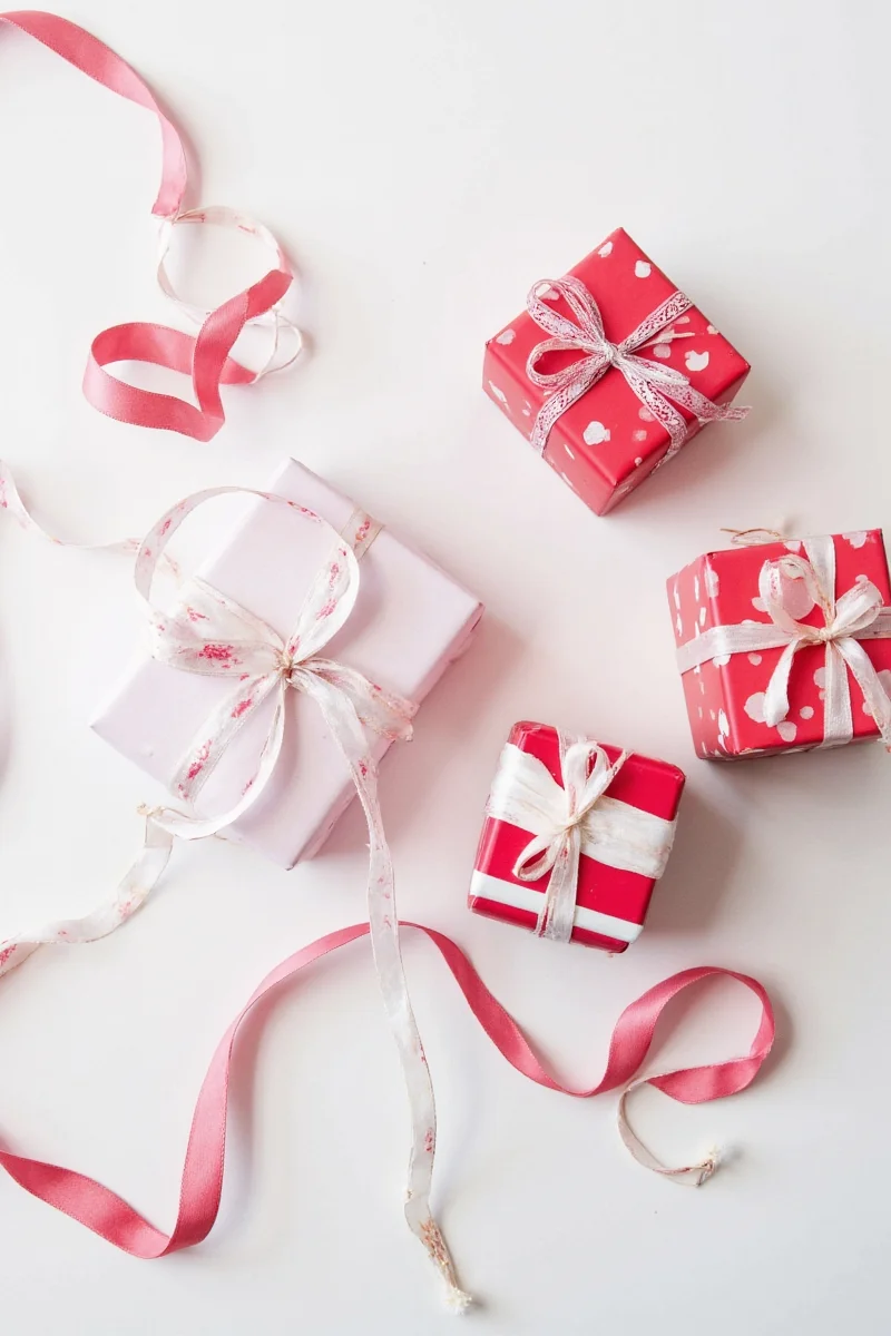Colorful satin bows on wrapped boxes