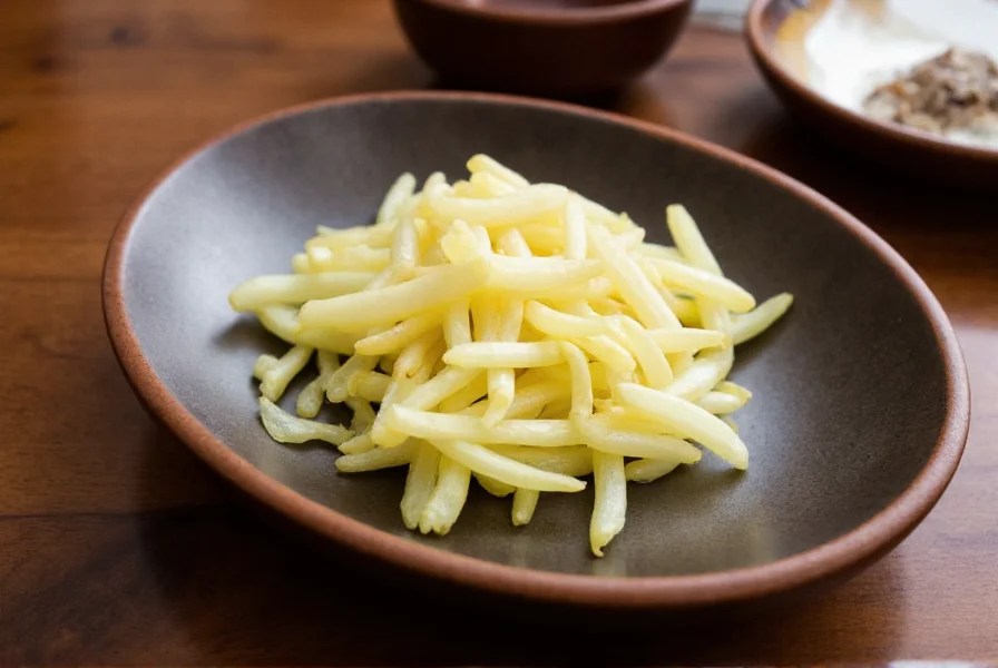 Myoga ginger flower buds sliced and arranged on a traditional Japanese ceramic plate