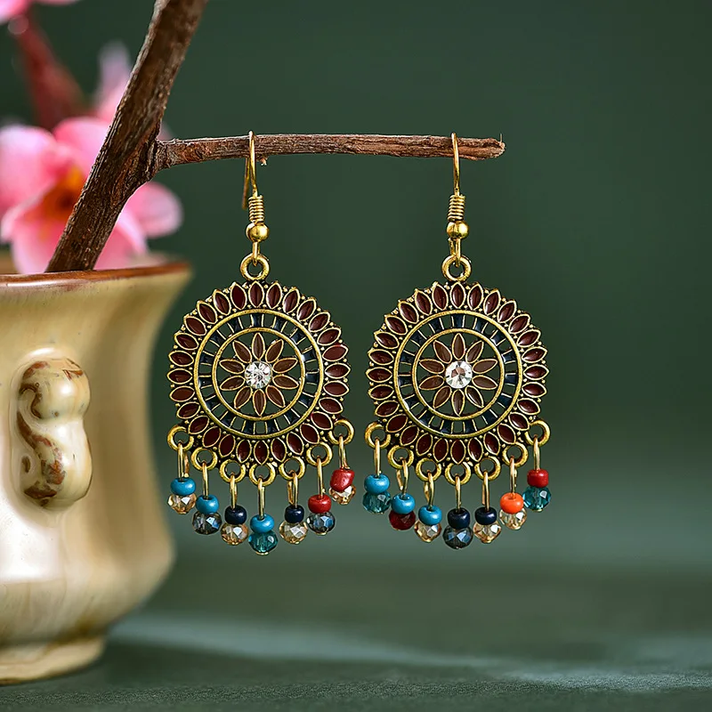 

Drop shipping 2021 american popular women fashion creative round sunflower alloy oil drop short rice bead earrings women jewelry, Picture shows