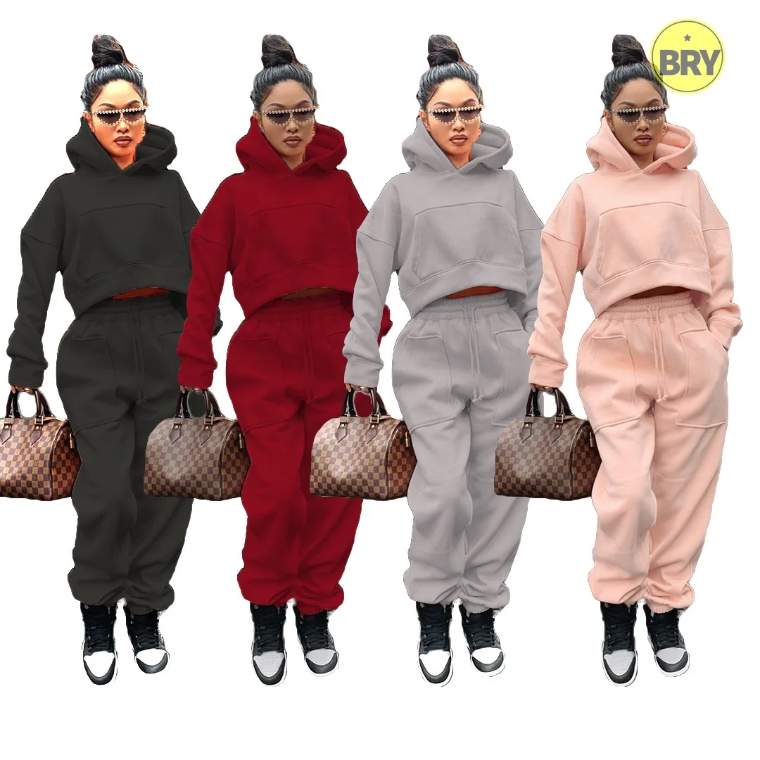 

2021 custom logo solid color pocket hoodie high waist letter printing trousers two piece loose casual 2 piece sets for women
