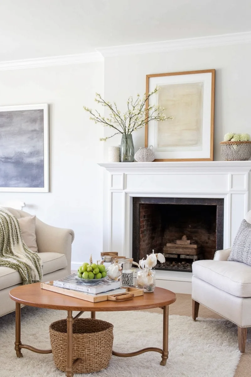 Pastel colored candles and vases on a mantel