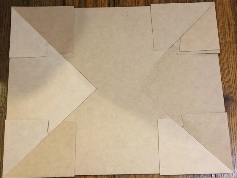 Reinforced cardboard gingerbread house corners with gussets