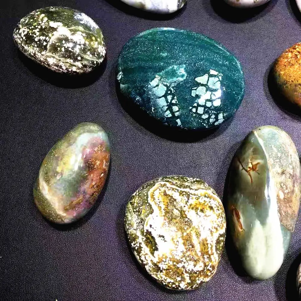 

Hot sale natural quartz crystal gemstone polished hand carved ocean jasper palm ply healing stones for home decoration