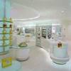 Brand cosmetic perfume store display fixture and counter with brand Backlit LOGO