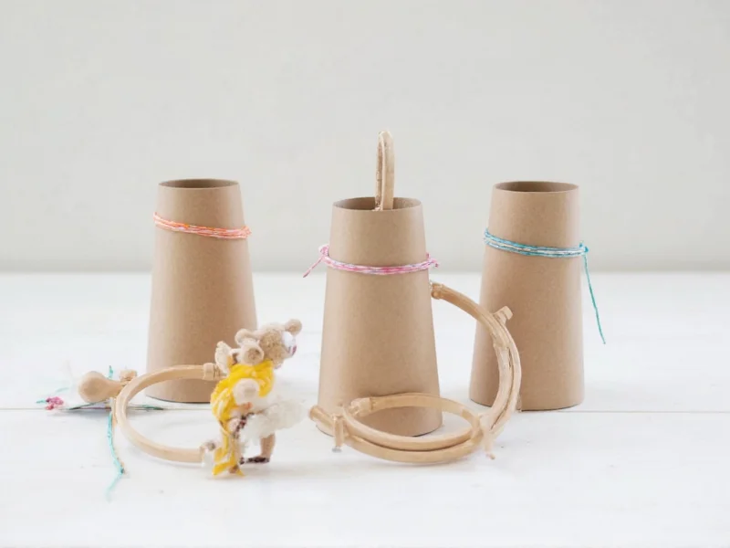DIY ring toss game using cardboard tubes and embroidery hoops