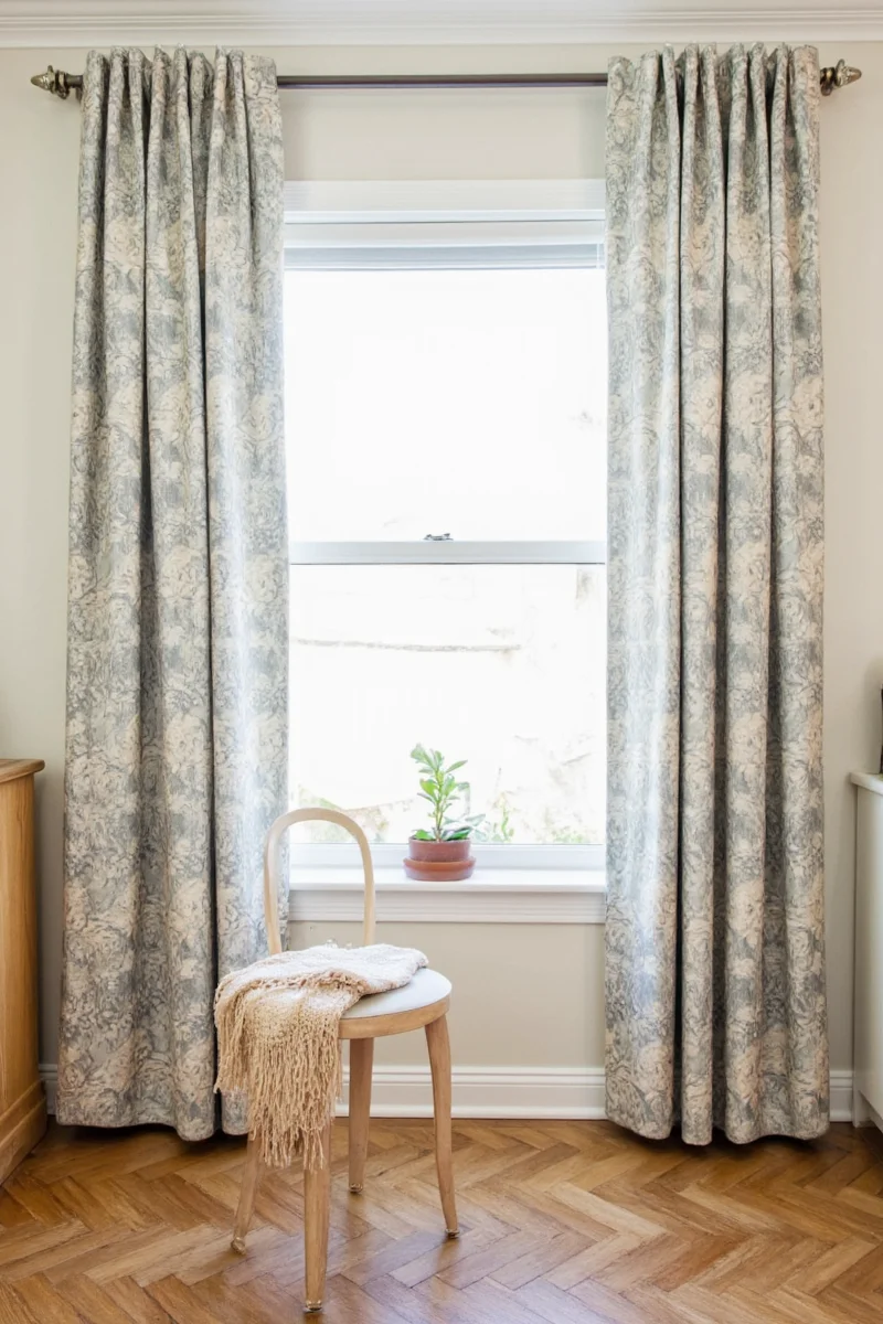 Tiered curtains covering the bottom half of a window