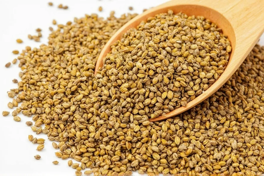 Chef's hands toasting mustard seeds in a cast iron skillet with steam rising