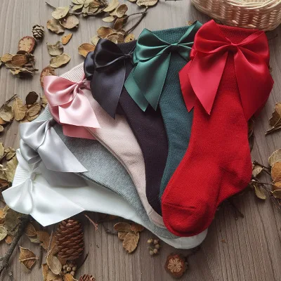 

Spain ins children's bowknot middle tube socks autumn winter big bow baby socks pure plain medium high hose
