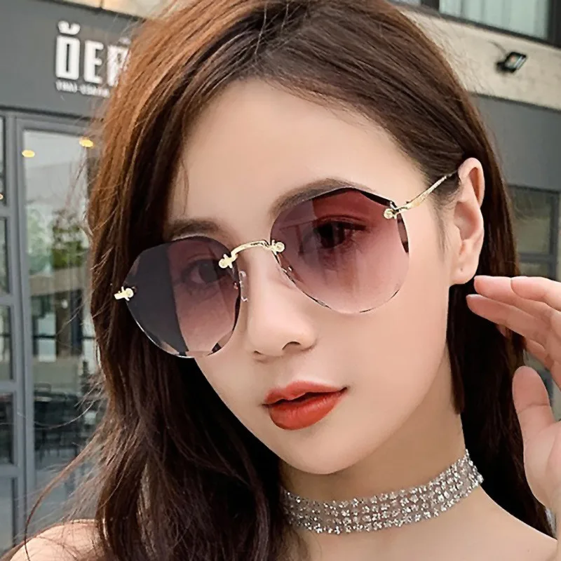 

Luxury Fashion New Trendy Rimless Metal Gradient Sun Lens 2021 Sunglasses Women