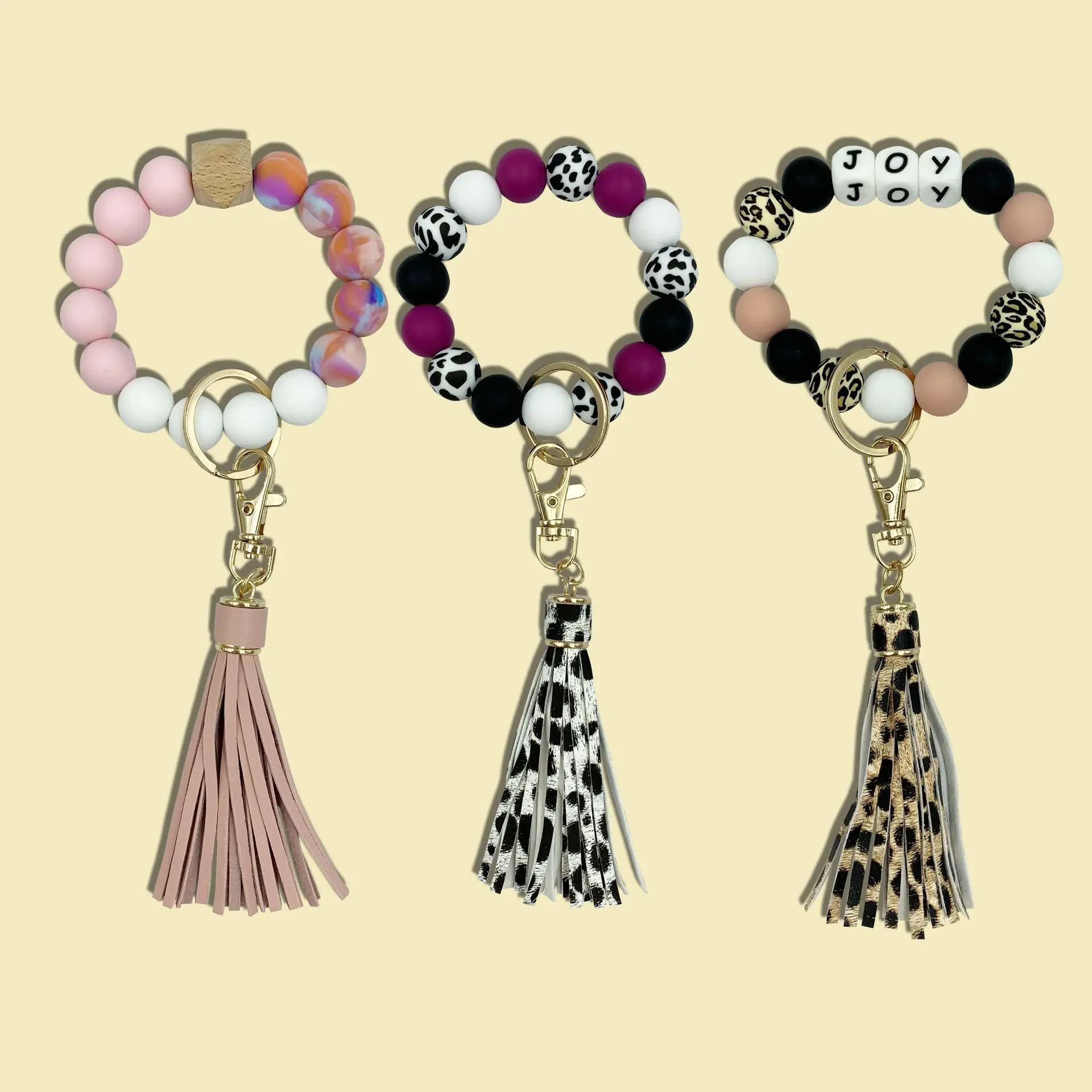 

Elastic rope wrist bracelet Silicone beads leather tassel key chain can be added wood chips, Photo shows