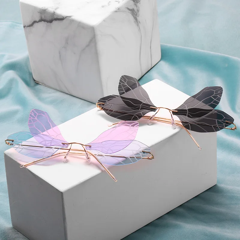 

DCOPTICAL 2021 Newest Fashion Party Rimless Shade Wing Wave Stage Sun Glasses Butterfly Fashion Shaped Sunglasses
