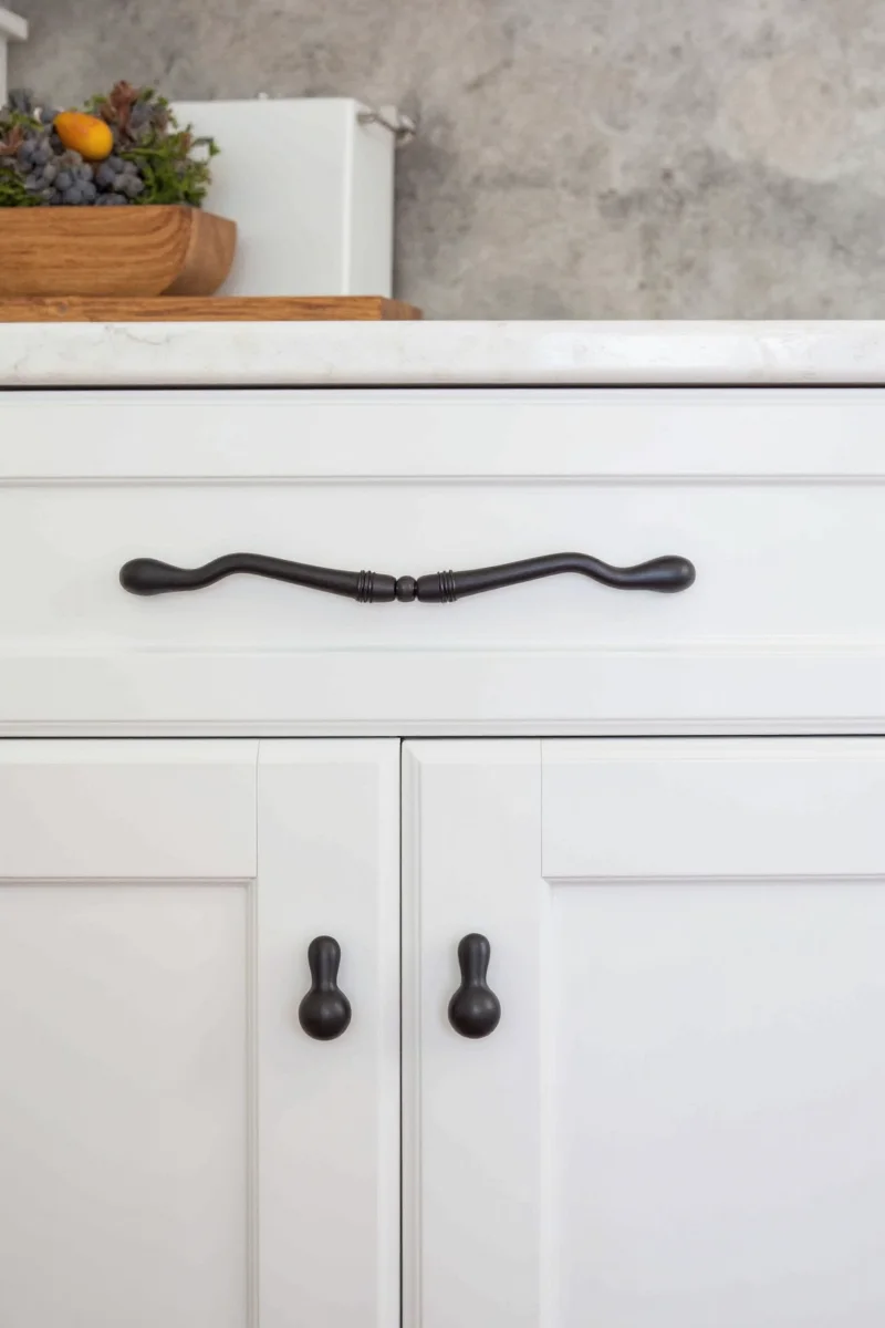 Comparison image showing different black cabinet knob styles