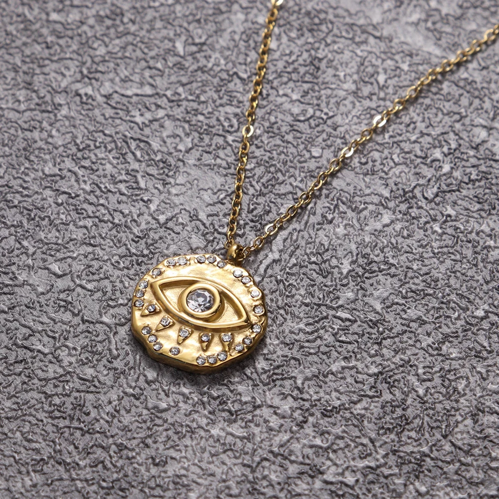 

Chris April Low MOQ 316L stainless steel PVD gold plating bumpy texture zircon eye coin pendent necklace