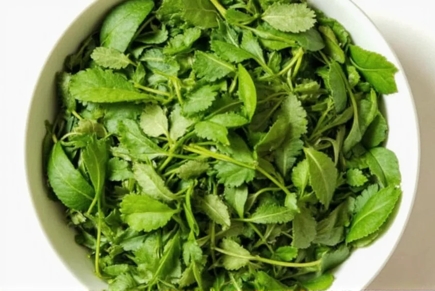 Close-up of fenugreek seeds and fresh methi leaves on wooden table