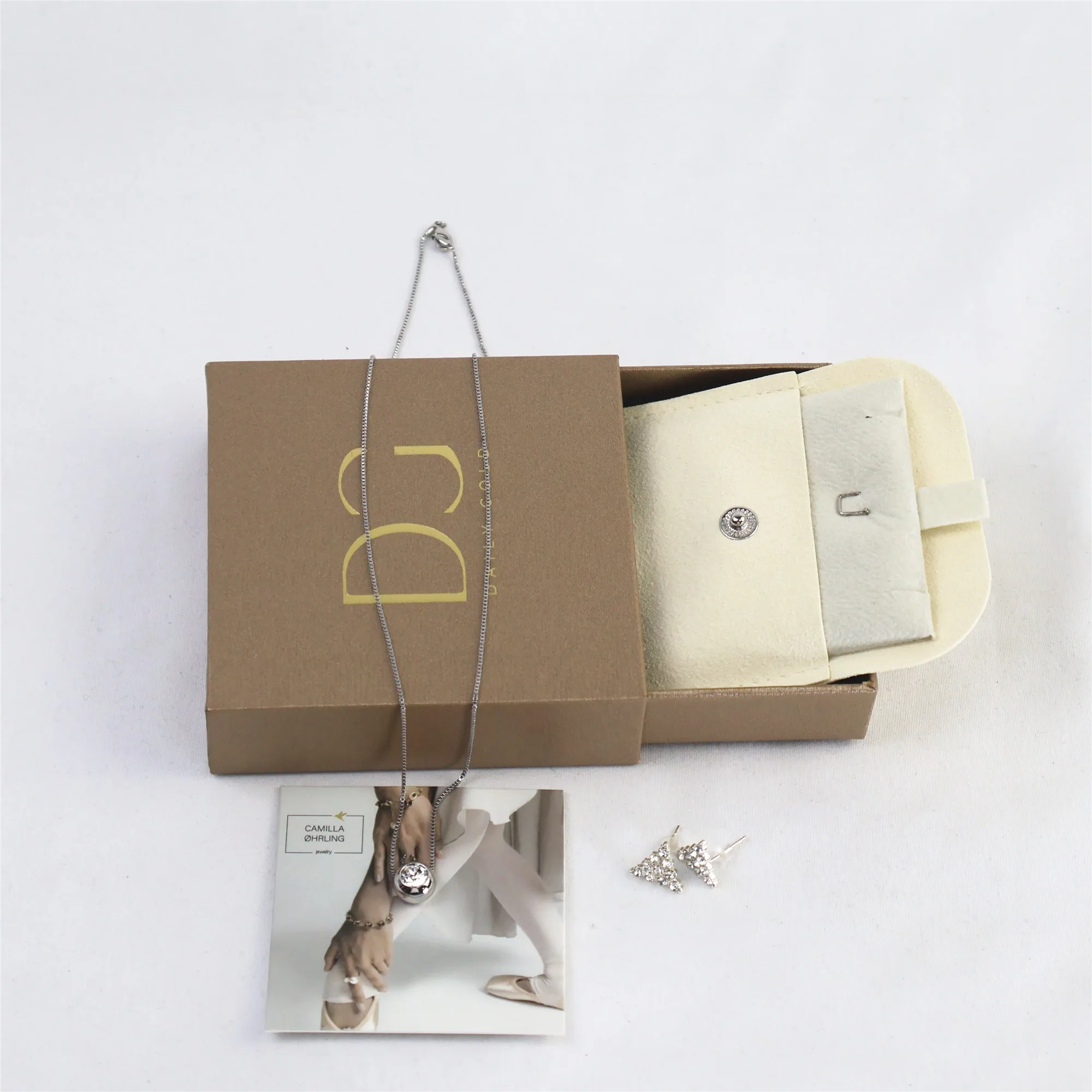 Macro view of technical drawer-style jewelry boxes with interchangeable multi-functional inserts.