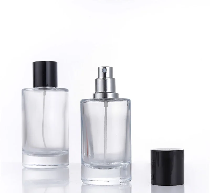 

Custom round empty clear fragrance cylinder fine mist sprayer black cap 50ml 100ml glass perfume bottle