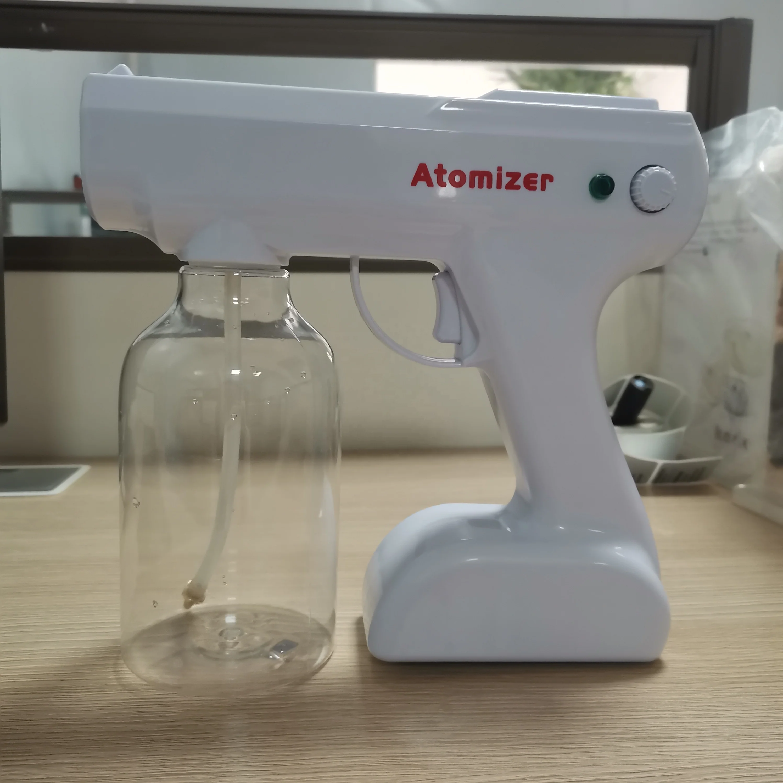 

New style healthcare supply electric blue ray wireless nano disinfection spray gun with rotary switch