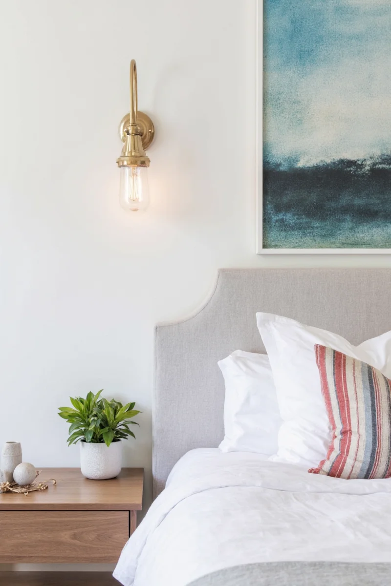 Modern bedroom with wall sconces beside bunk beds