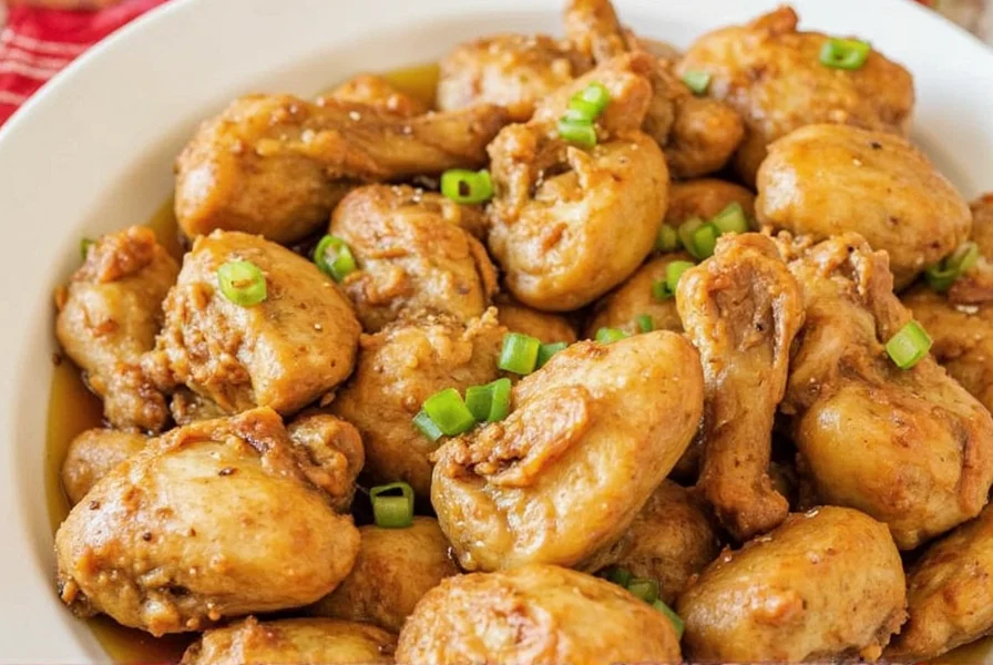 40 clove garlic chicken roasting in cast iron skillet with golden brown chicken and caramelized garlic