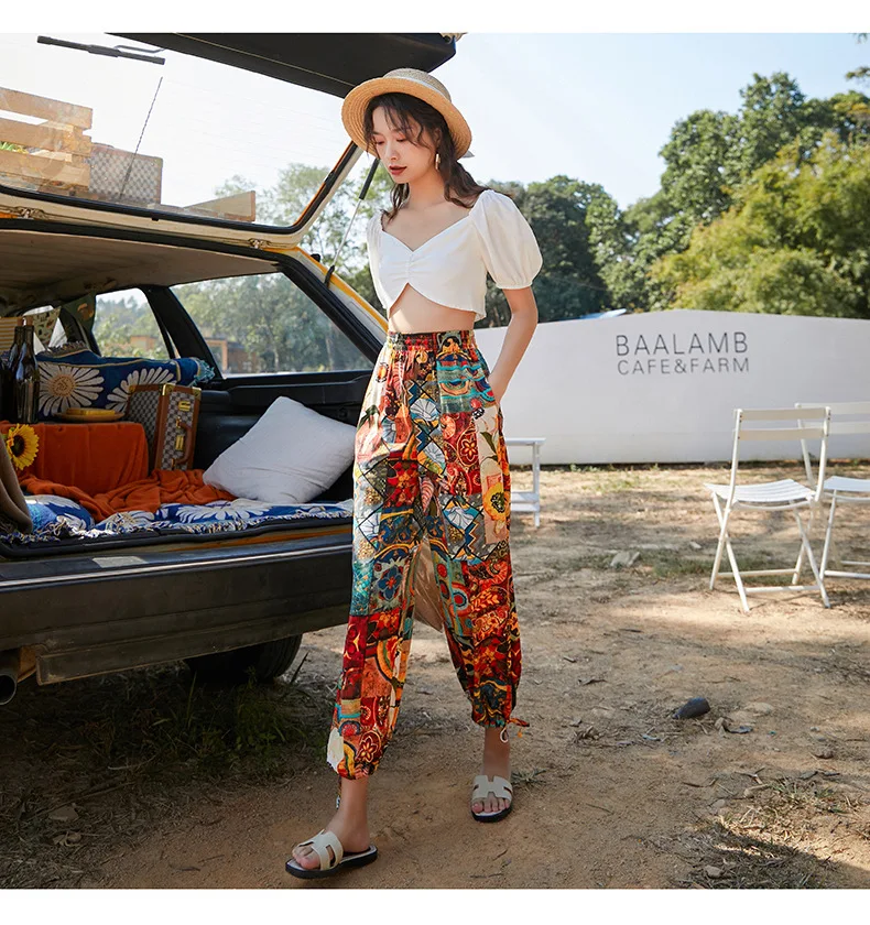 

New Fashion Design Summer Eye Catching Oem Support Printed Polyester Elastic Women Pants