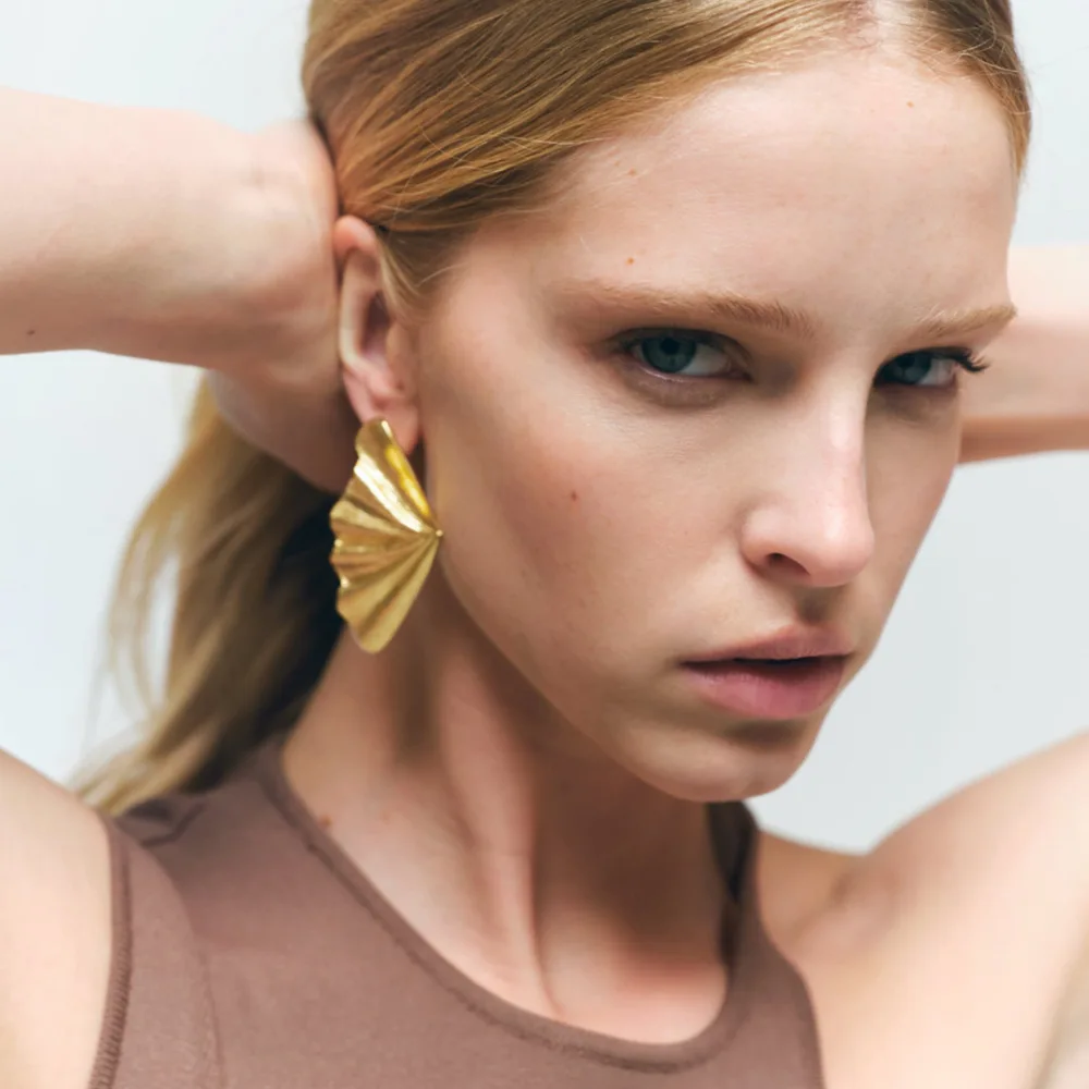 

European and American retro holiday style pleated metal leaf earrings