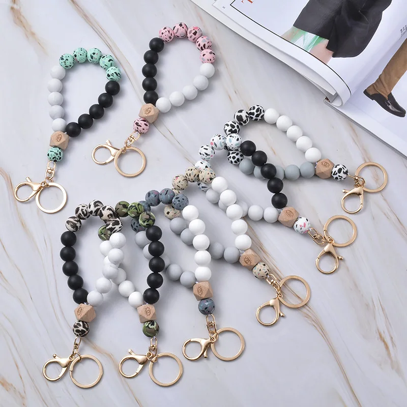 

Handmade Wood and Silicone Leopard Bead Bracelet With Tassel Elastic Size Fashionable Keychain Bracelet Holder Wristlet Bracelet