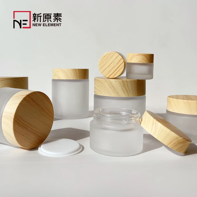

Wholesale 5g 10g 15g 30g 50g 100g cream skincare packaging white frosted cream glass jar with bamboo Plastic wood grain lid
