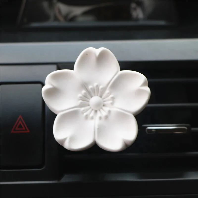 

Factory Aroma Scented White Ceramic Sakura Shaped Fragrance Oil Diffuser Stone Car Vent Clip Air Freshener