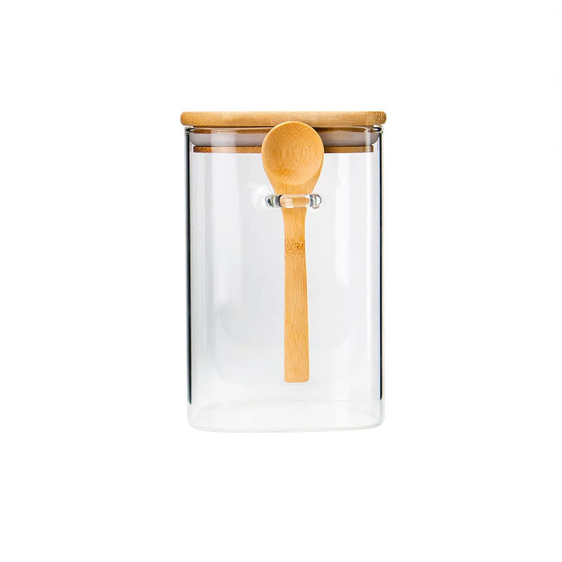 

Amazon Hot Sale Glass Seasoning Jar With Wood Lid And Spoon High Borosilicate Glass Nut storage jar, Transparent