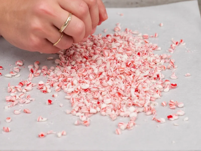 Crushing candy canes into fine crumbs for peppermint bark