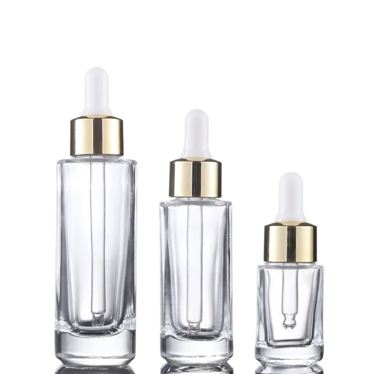 

Custom logo 15ml 30ml 50ml clear square dropper bottle with gold and silver personal care production cosmetic package container