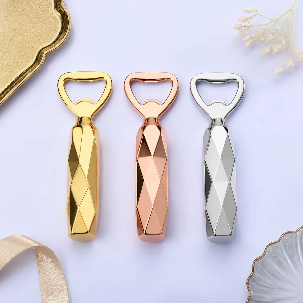 Faceted bottle openers in gold, rose gold and silver arranged in a row