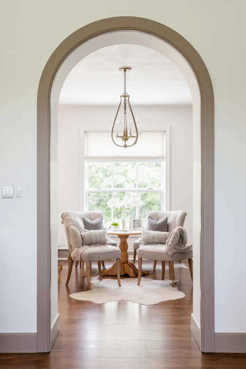 Child helping parent install arched doorway molding