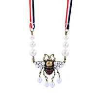 

xl00673c Halloween Christmas Gift Hot Selling Latest Design Dangle Pearl Bead Insect Series Cute Bee Ribbon Pendant Necklace