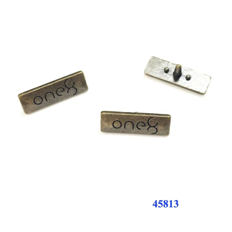 
Manufacturer designs shoe accessories metal brand name logo with legs 