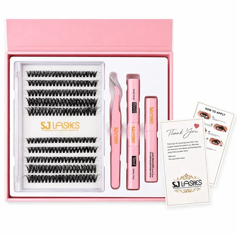 Segmented lash gift box set with white lid and soft pink base, gold filigree, clear tray with 13 rows of cluster lashes, pink tweezers, dual ended bond seal and remover, how to apply card and thank you card - OEM ODM private label